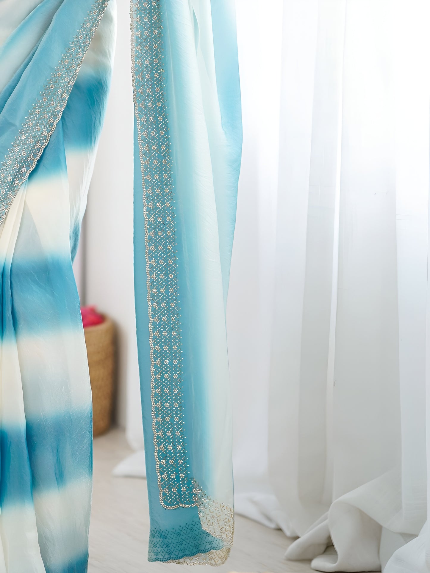 Sky blue Space Silk festive saree with stylish printed border and Mono Silk blouse.