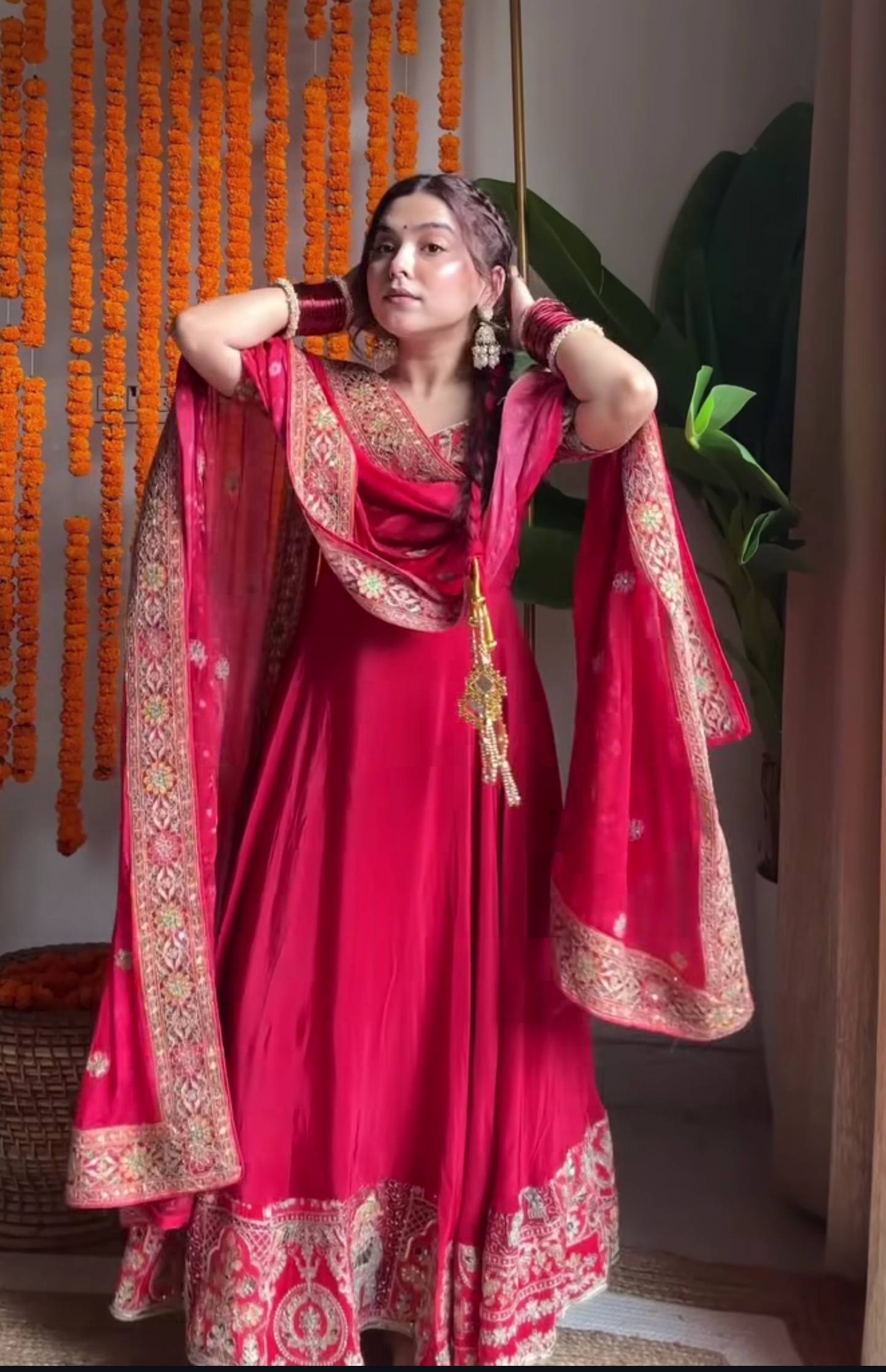Close-up of 5mm sequence and heavy embroidery work on red Anarkali gown
