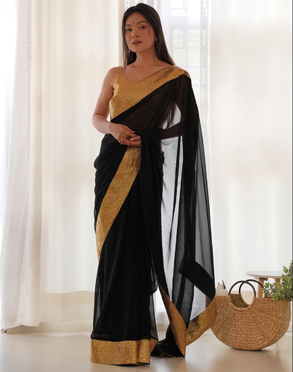 Black georgette saree with golden broad sequinned lace border front view