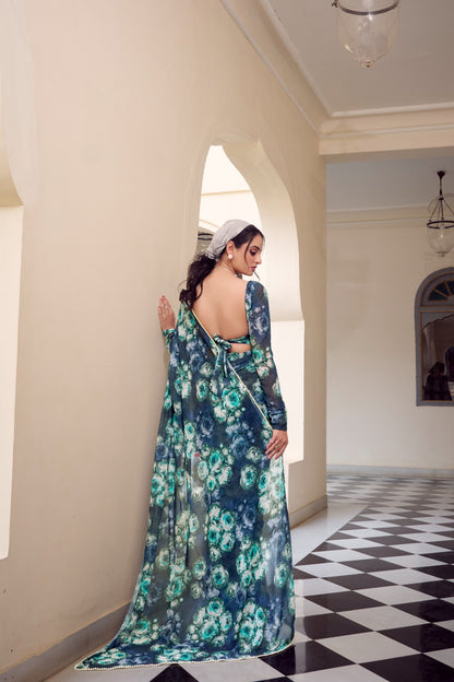 Full-length view of blue floral printed Soft Georgette saree with matching floral blouse.