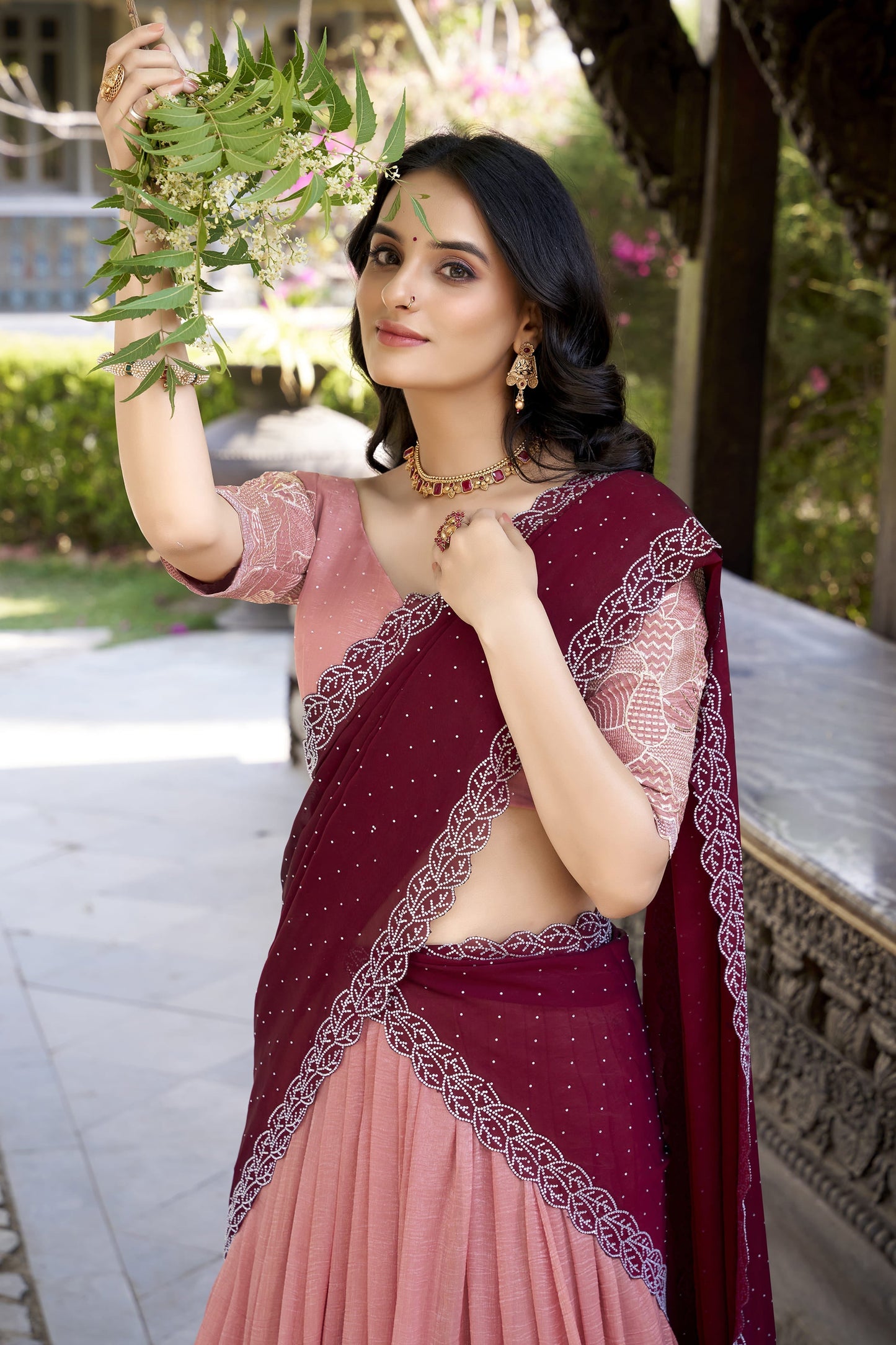 Elegant blush pink lehenga featuring heavy embroidered floral border and matching blouse