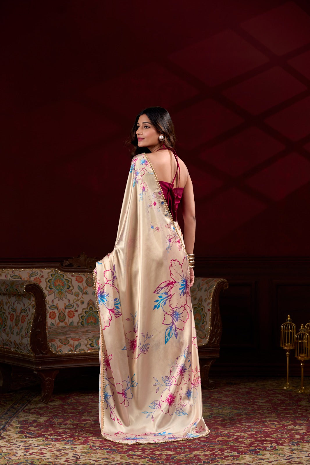 Model wearing cream floral digital print Japan satin silk saree with matching blouse piece.