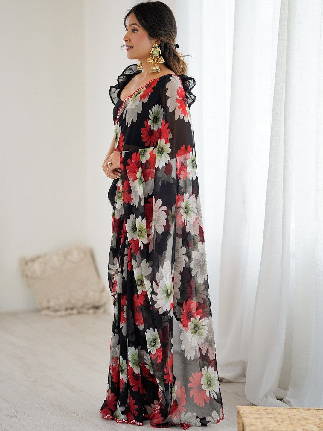 Designer black georgette silk saree with floral print and mirror work lace border