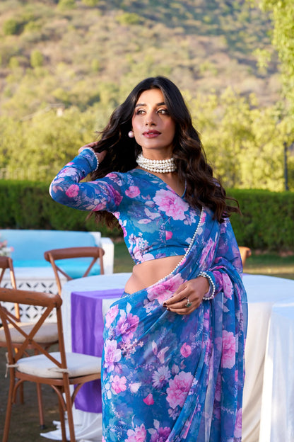 Designer blue soft georgette saree with floral print and pearl lace border