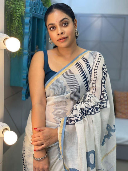 Designer white linen cotton saree featuring sky blue geometric border and digital print