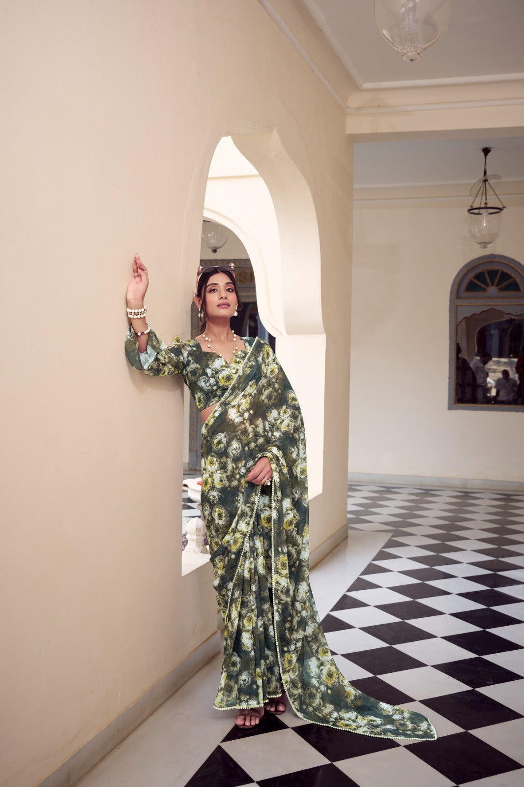 Designer olive green floral print Soft Georgette saree with pearl lace border for festive wear