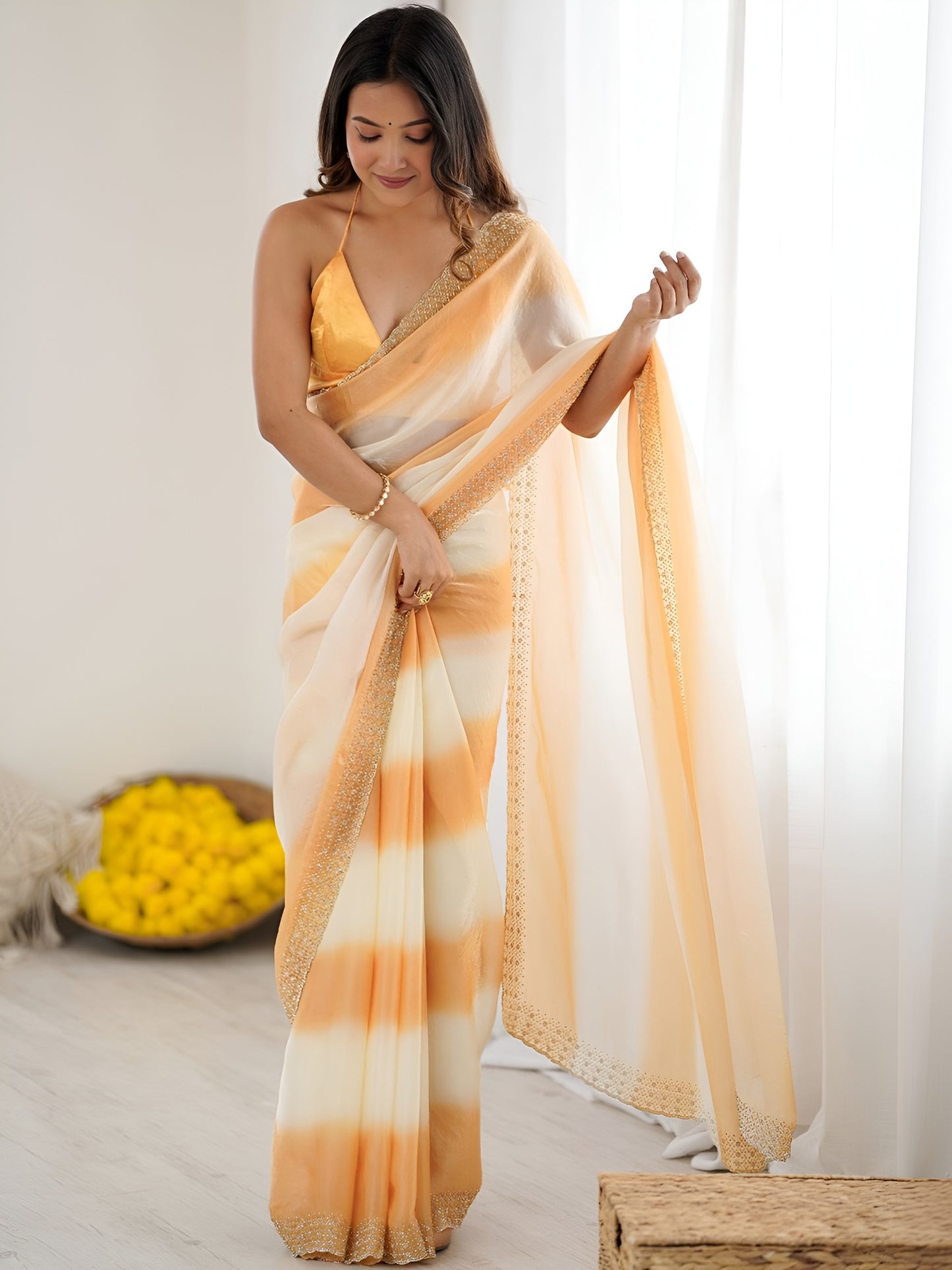 Designer orange Space Silk party wear saree featuring printed patta and diamond work.