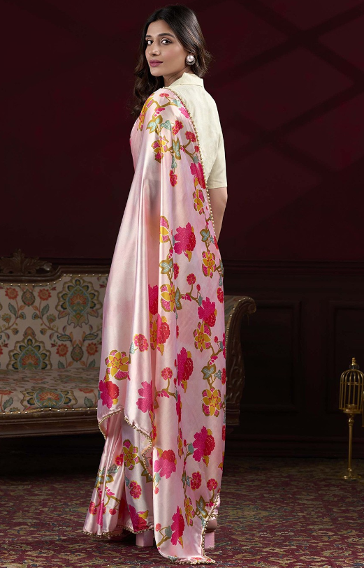 Designer peach satin silk party wear saree with elegant floral digital print and pearl lace border.