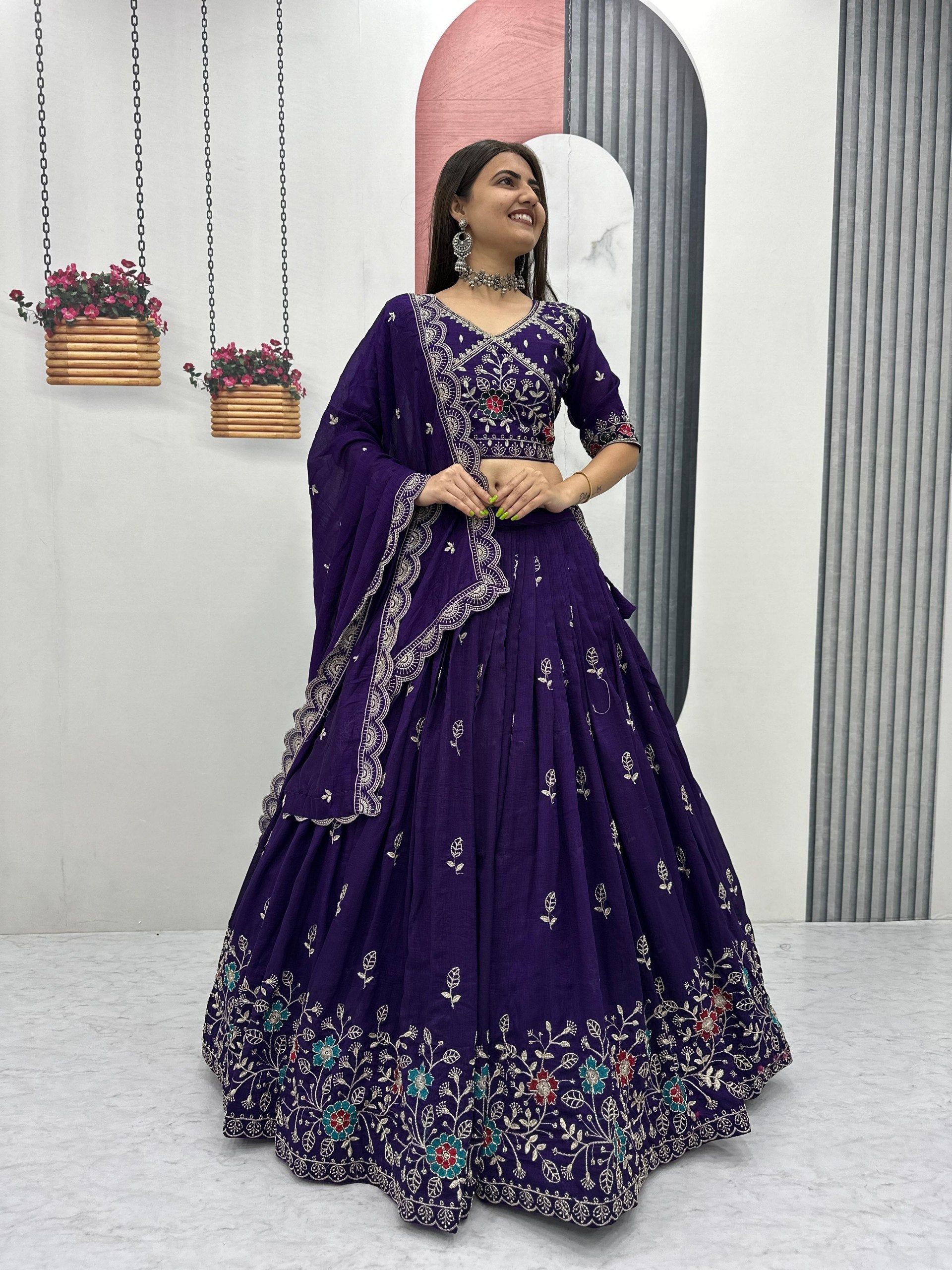 Designer purple bridal lehenga choli with floral embroidery and elegant dupatta