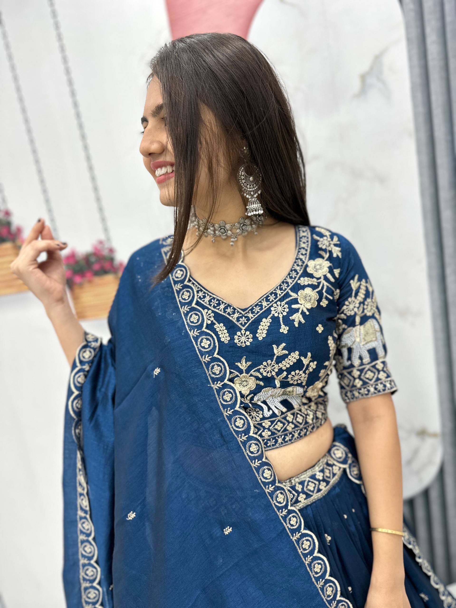 Designer rama blue lehenga choli with intricate embroidery and elegant dupatta
