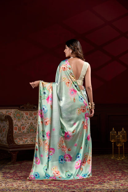 Designer sea green satin silk party wear saree with elegant floral digital print and pearl lace border.