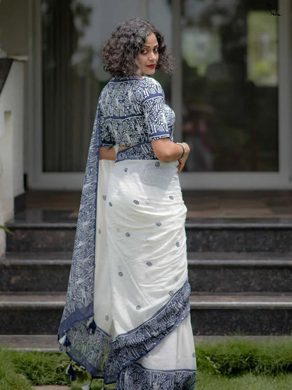 White designer saree featuring blue printed pallu and matching blouse for festive wear