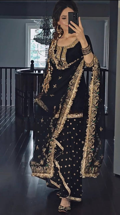 Close-up of mirror and sequence embroidery work on dhoti suit top