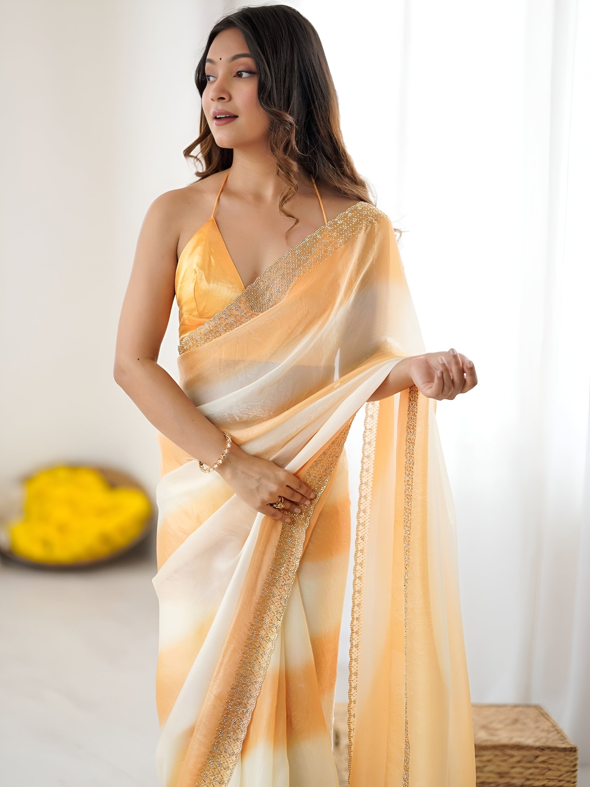 Elegant orange designer Space Silk saree with original Jarkhan diamond work for weddings and parties.