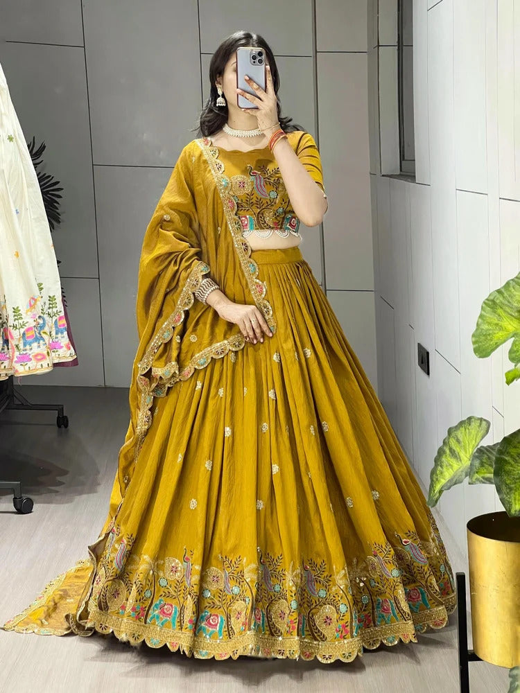 Ethnic mustard party wear lehenga choli with handcrafted embroidery and elegant dupatta