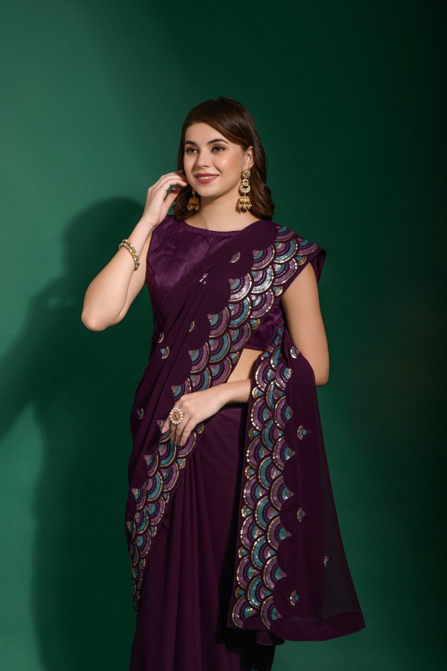 Festive wear heavy georgette purple saree with colourful sequin floral work and stylish piping border.