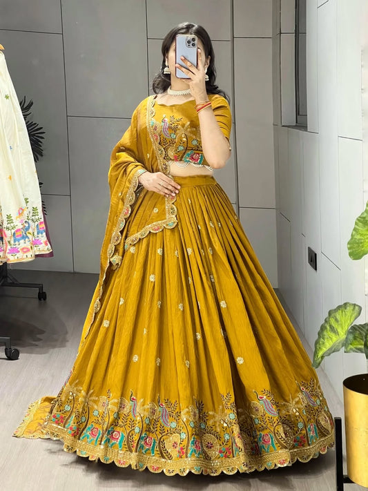 Mustard silk lehenga choli with peacock and elephant embroidery for wedding and festive wear