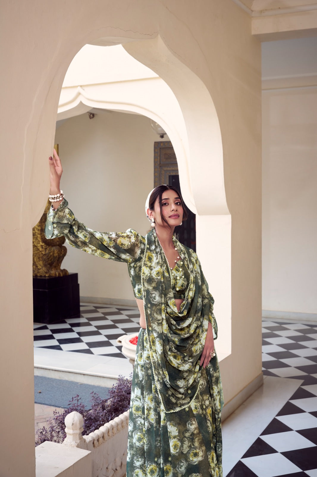 Full-length olive green floral printed Soft Georgette saree with matching floral print blouse.