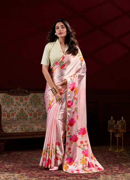 Model wearing peach floral digital print Japan satin silk saree with matching blouse piece.