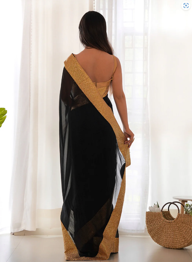 Premium black georgette wedding wear saree featuring golden lace embroidery