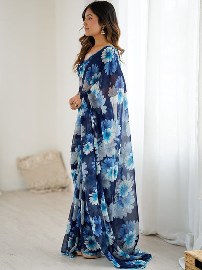 Premium blue georgette silk saree featuring multicolor floral print and mirror work border