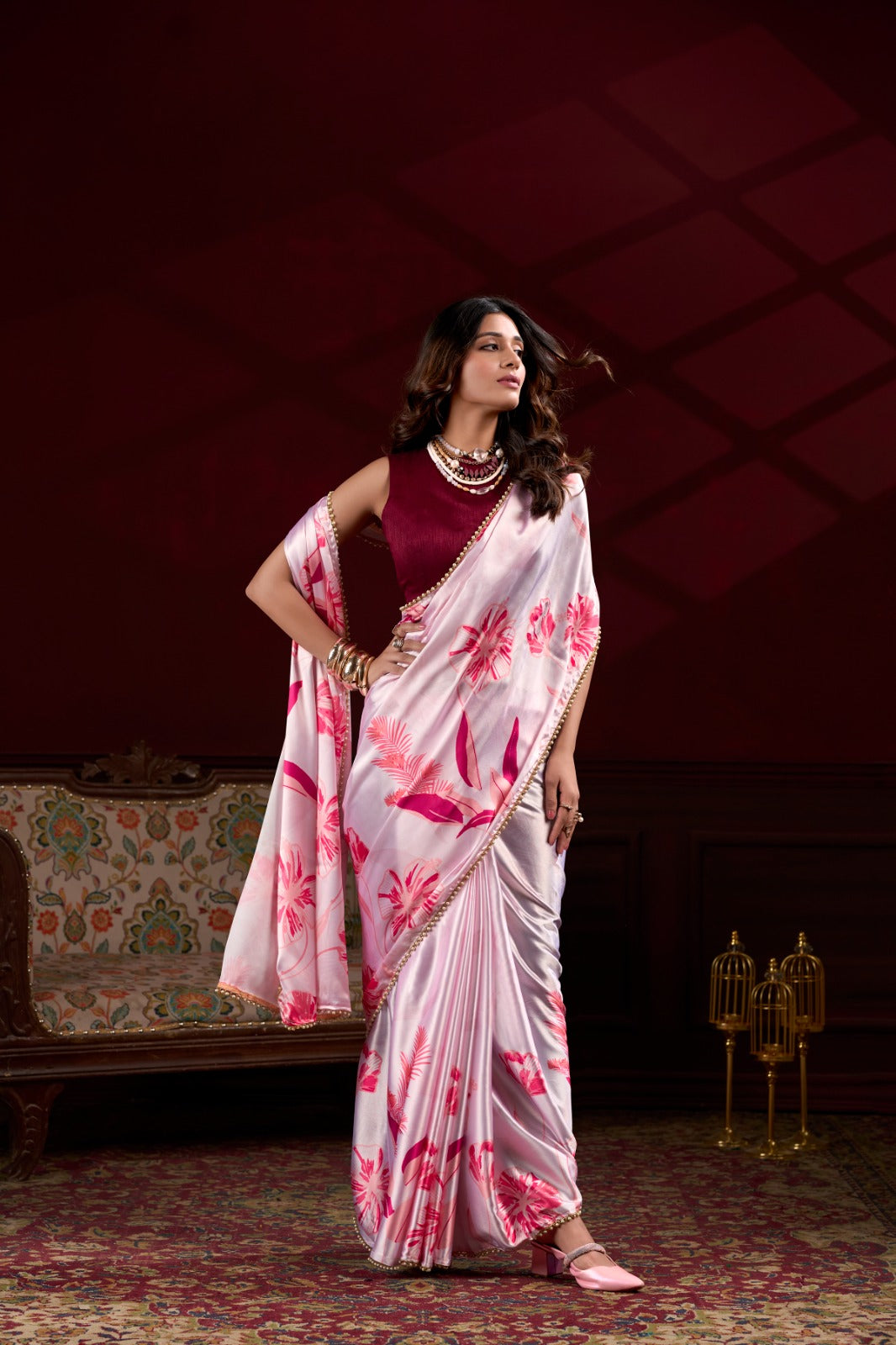 Premium pink Japan Satin Silk saree featuring all-over floral print and stylish pearl lace border.