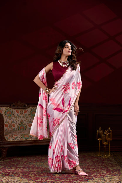 Premium pink Japan Satin Silk saree featuring all-over floral print and stylish pearl lace border.