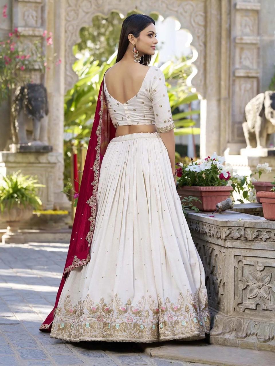 Premium white party wear lehenga choli for women with embroidered detailing