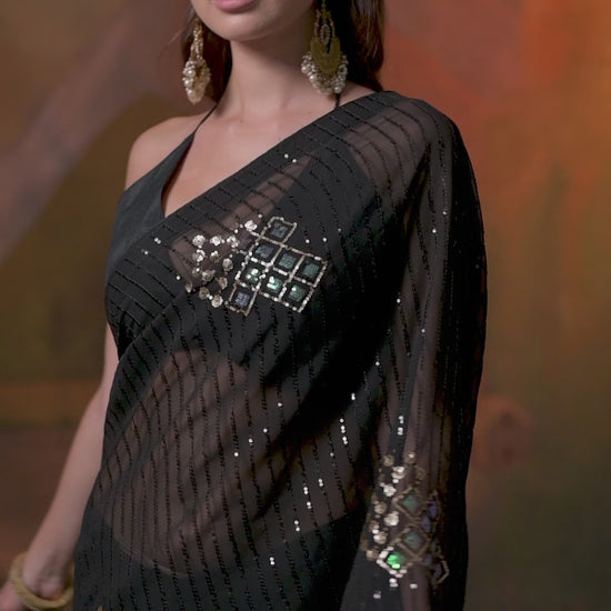 Designer black embroidered Soft Georgette party wear saree with stylish lace border and elegant drape for women.