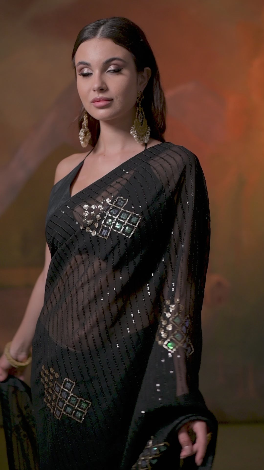 Designer black embroidered Soft Georgette party wear saree with stylish lace border and elegant drape for women.