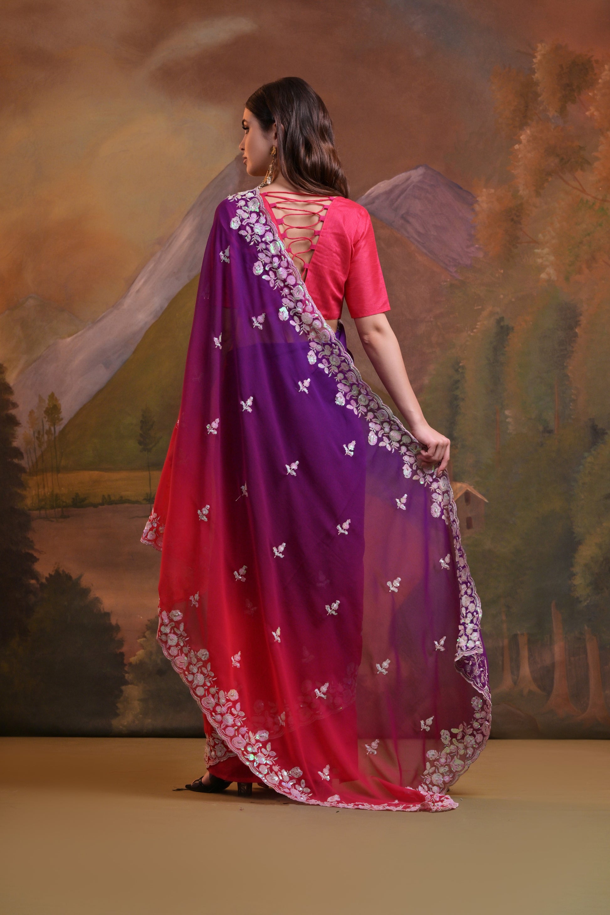 Full-length view of purple and pink embroidered Soft Georgette saree with elegant sequence work and matching blouse.