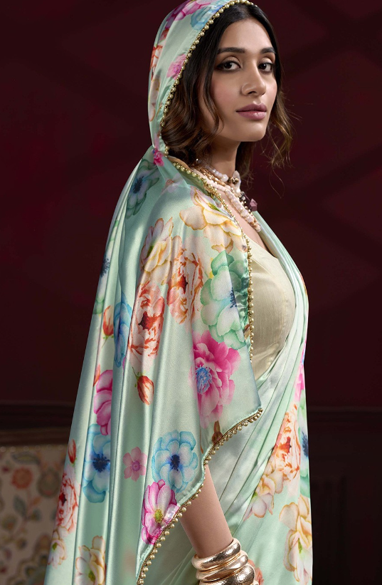 Model wearing sea green floral digital print Japan satin silk saree with matching blouse piece