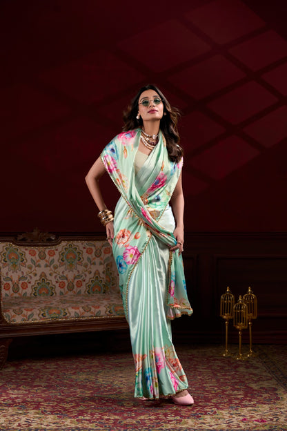 Sea green Japan Satin Silk floral printed saree with pearl lace border front view for women.