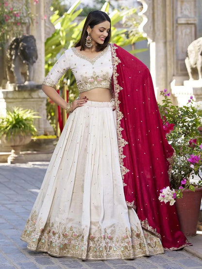 Traditional white ethnic lehenga set with embroidered blouse and pink dupatta