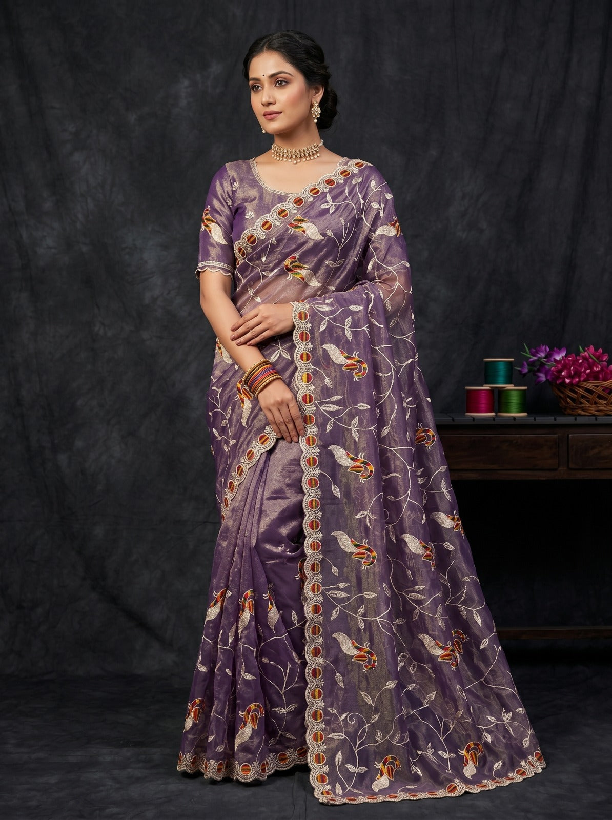 Close-up of Violet Net Saree with Peacock Thread Embroidery