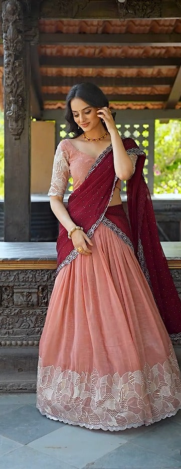Wedding wear blush pink lehenga choli with intricate embroidery and stylish drape