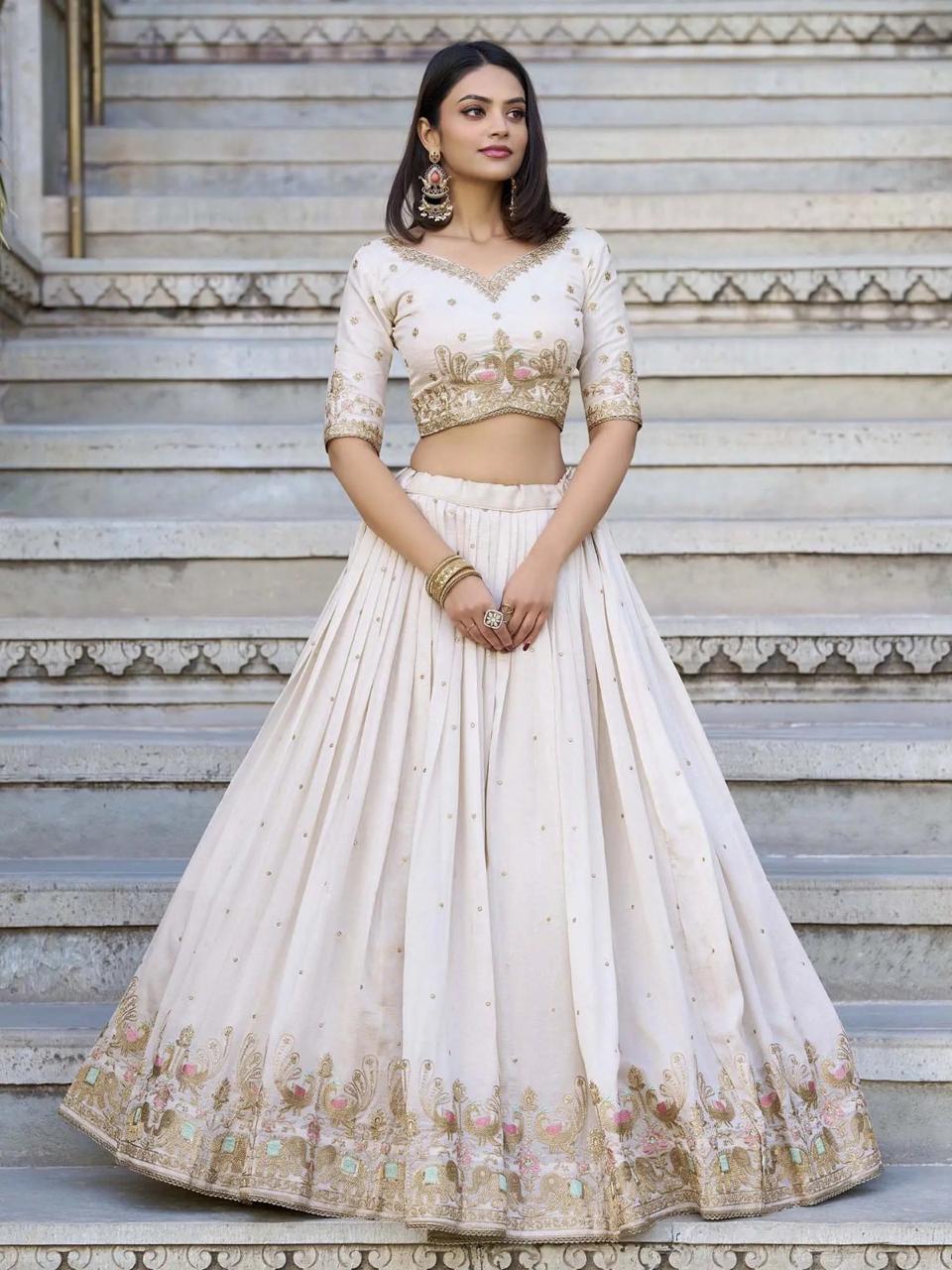 White bridal style lehenga choli with elegant embroidered border