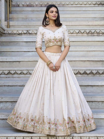 White bridal style lehenga choli with elegant embroidered border